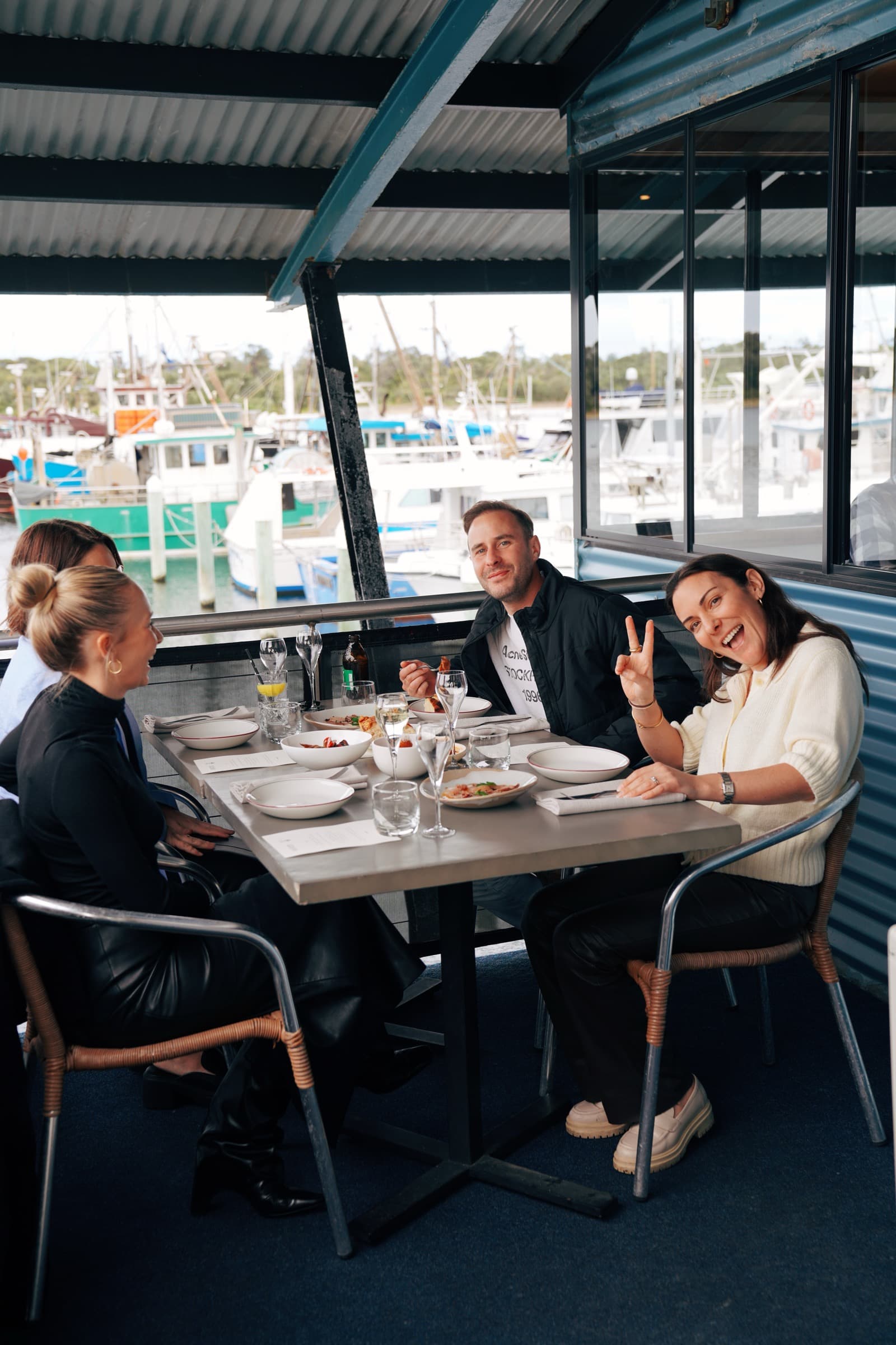 Friends dining at the marina